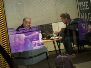 Andro Lindsay & Alberto Scherb - Co-founders of 100 Thousand Million, hold a business meeting in a glass fronted meeting room at Epicenter Helsinki.