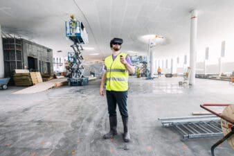 Show on Map Helsinki 24/7 - man trying VR at Oodi Library construction site