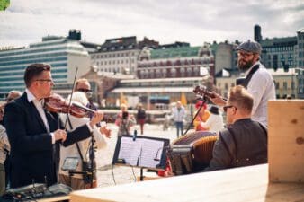 Musicians playing music in the Helsinki market square in the summer