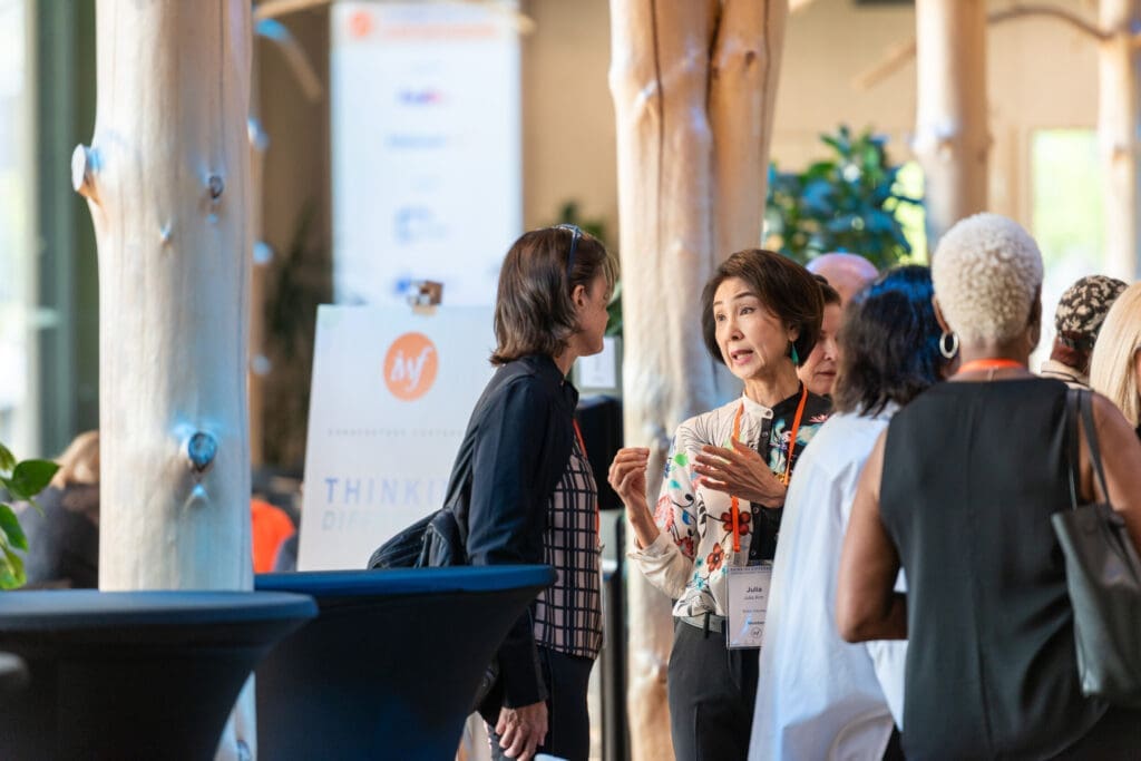 Diverse group of women in discussion at a conference