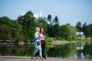 Business women walking along the bay during summer