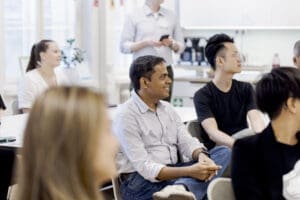Founders to Finland participants listening to a presentation at the Helsinki Partners office.